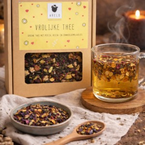 Vrolijke thee van Arelo met groene thee, perzik, rozen en zonnebloembladen in cadeauverpakking